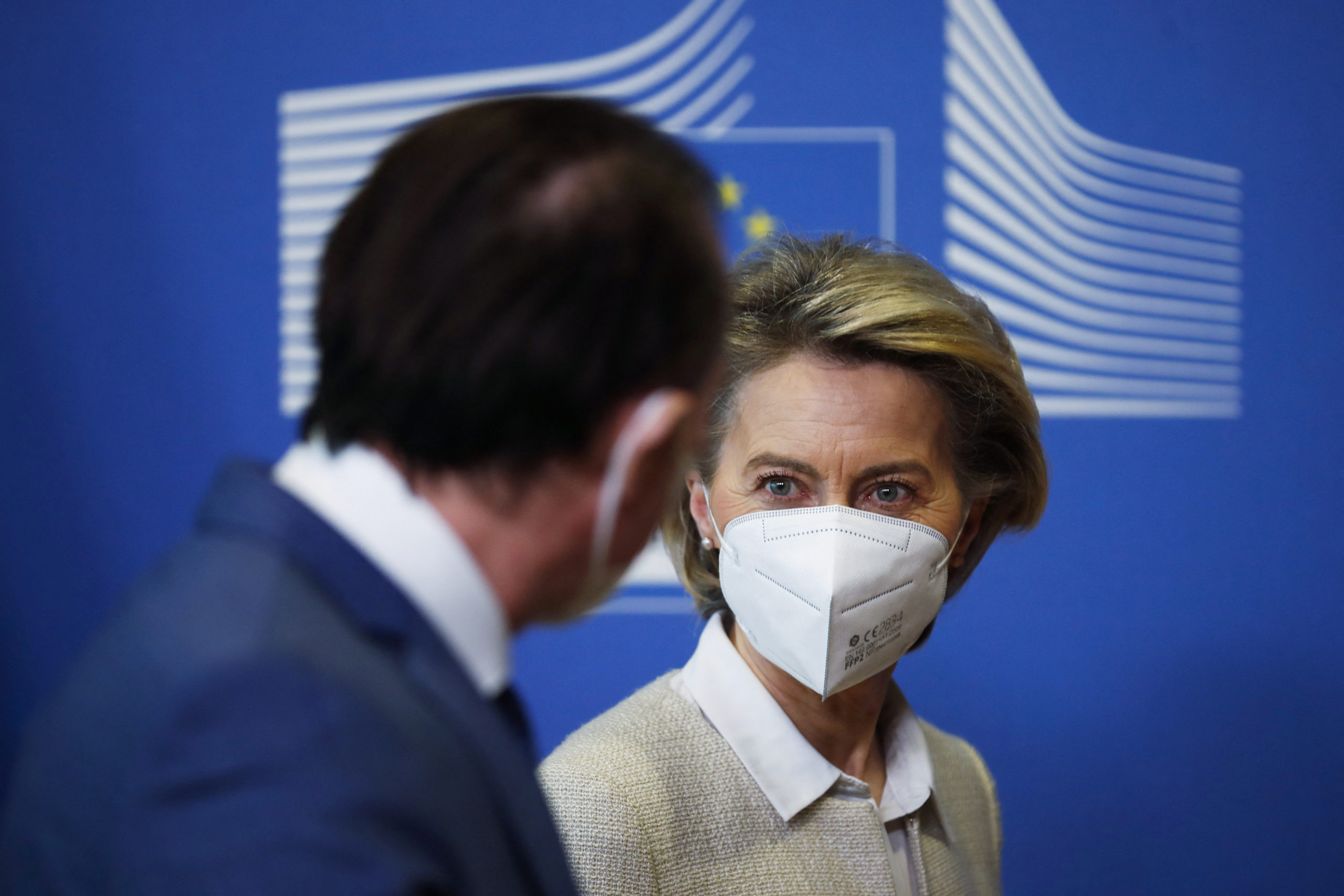 European Commission President Ursula von Der Leyen (R) welcomes Romanias Prime Minister Florin Citu before their meeting at the European Commission headquarters in Brussels on February 12, 2021.